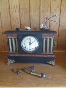 Antique Ingraham mantle clock with misc winding keys and miniature figurine decor