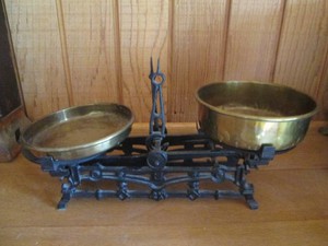 Antique cast iron counting scale with faux floral decor