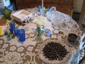 Colorful array of beautiful vintage depression Era glassware including shot glasses, Lidded candy dishes and home decor