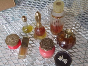Collection of assorted womens decorative bottle perfumes and body products