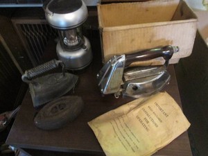 Vintage Sad irons and a gasoline iron