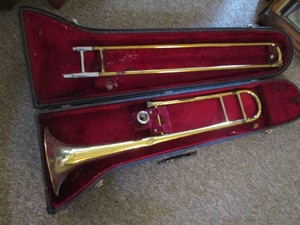 Vintage Trombone with case and silver mouth piece
