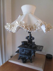 Vintage Old fashioned cast iron stove with accessories table lamp with shade