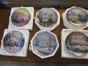 Collection of decorative An Old Fashioned Christmas with Thomas Kincade display plates