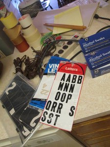 Collection of assorted household items to include freezer paper, various tape, extension cords, alcohol swabs, and assorted items shown in pics