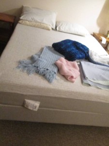 Afghan blankets and mattress pads with Queen size sleep number bed and remote