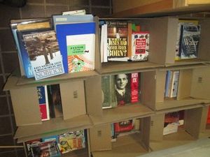 12 Boxes of hard and soft cover books