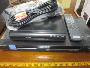 Sony DVDCDVIDEO CD player plus misc DVDCD player, misc remotes, cables and mini vacuum cleaner attachments