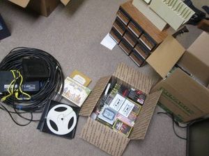 Lot of cassette tapes, holders and coaxial cable and other vintage electronic accessories