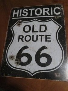 Route 66 metal sign measures 12 x 14 inches