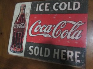 Coca cola metal sign measures 12 x 14 inches