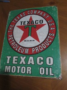 Texaco metal sign with authenticity sticker measures 12 x 14 inches