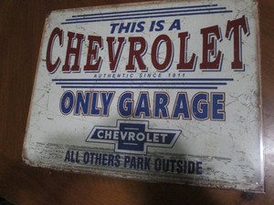Chevrolet metal sign with authenticity sticker measures 12 x 14 inches