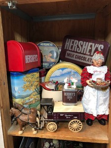 Hershey collectible figurines all in bottom cabinet