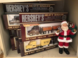 Hershey collectible figurines in bottom cabinet with drawers