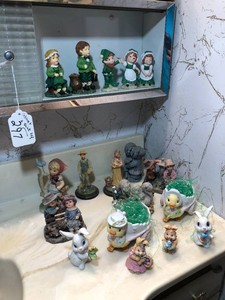 Lefton collectibles and other knick-knacks all in medicine cabinet and top of sink