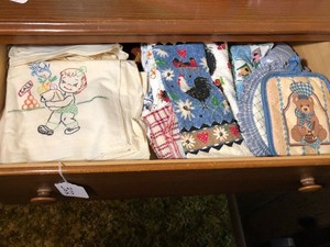 Embroidered dish towels and other new towels all in drawer