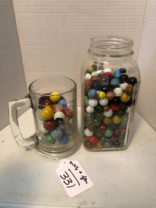 Mug and jar of marbles