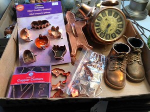 Copper colored items - baby shoes, clock, cookie cutters