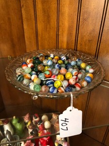 Glass bowl with assorted marbles