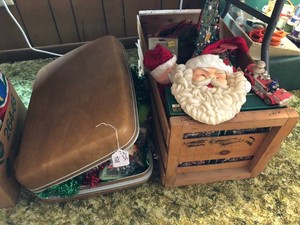 Christmas decorations, suitcase and crate of