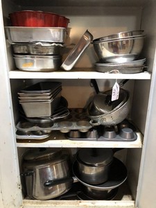 Bakeware and pans all on bottom 3 shelves