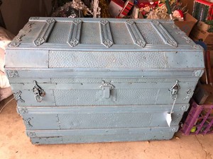 Blue flat top trunk, has been painted