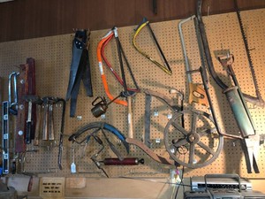All items on wall pegboard - saws, levels, hand tools and more