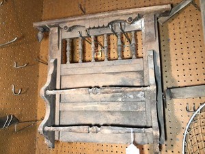 Vintage wall piece and saw