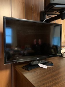 LG small flat screen TV with remote