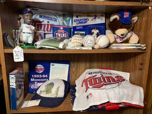MN Twins memorabilia all on 2 shelves