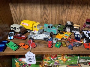 Toy cars and trucks, most are metal