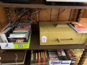 RCA record player, CDs all on middle shelf