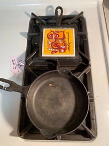 Cast iron skillet and Holt Howard trivet