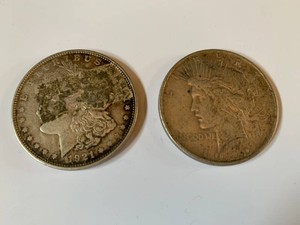1921 Morgan silver dollar and 1922 silver Peace dollar