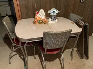 Chrome metal table with leaves and 3 chairs LOCATED IN BASEMENT