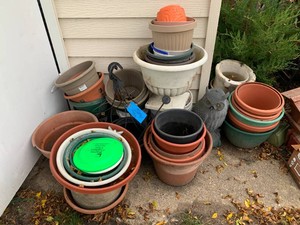 Large assortment of plastic flower containers