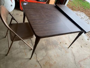 Formica top table with folding chair