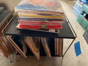 Assorted vinyl records and  metal stand
