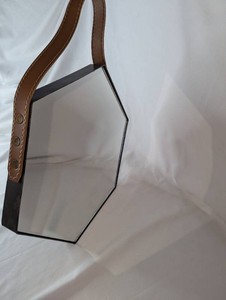 Hexagonal Black Metal Wall Mirror with Brown Hanging Strap  Approximately 14 Wide
