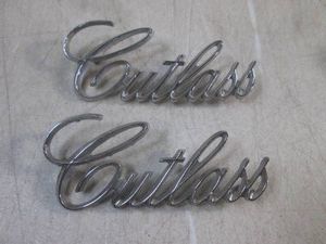 (F-0) Pair of 1971-72 Oldsmobile Cutlass Trunk Script Emblems OEM #9851757
