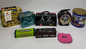Assorted Collectible Tin Lunch Boxes & Advertising Tins  Minions, Monsters Inc., Hot Wheels, M&Ms & More