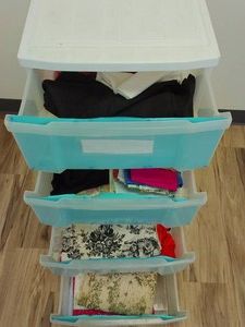LARGE PLASTIC 4 DARWER UNIT FULL OF FABRIC