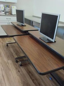 2 ROLLING COMPUTER DESKS WITH HP COMPUTER MONITORS