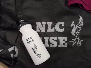 BOX OF POLO T-SHIRTS AND BOX FULL OF BAGS WITH WATER BOTTLES