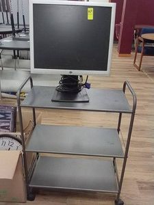 HP COMPUTER MONITER ON METAL ROLLY CART