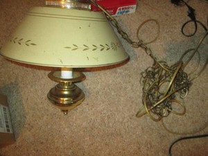 Vintage metal bowl style hanging lamp with floral design and chain shown