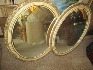 Pair of Decoratively carved frame oval wall mirrors approx 34in