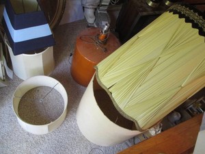 Large carboy style table lamp with assorted vintage shades