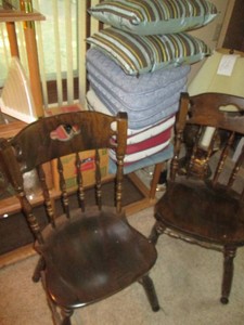 Pair of vintage wood dining chairs plus stack of seat cushions